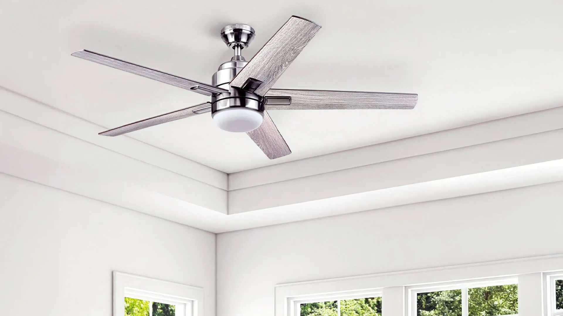 Electrician consulting with Gold Coast homeowner about ceiling fan placement